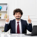 customer-service-curly-brunette-young-man-office-suit-red-tie-with-laptop-excited (1)