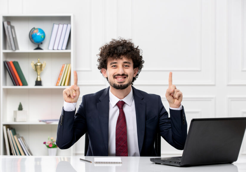 customer-service-curly-brunette-young-man-office-suit-red-tie-with-laptop-excited (1)