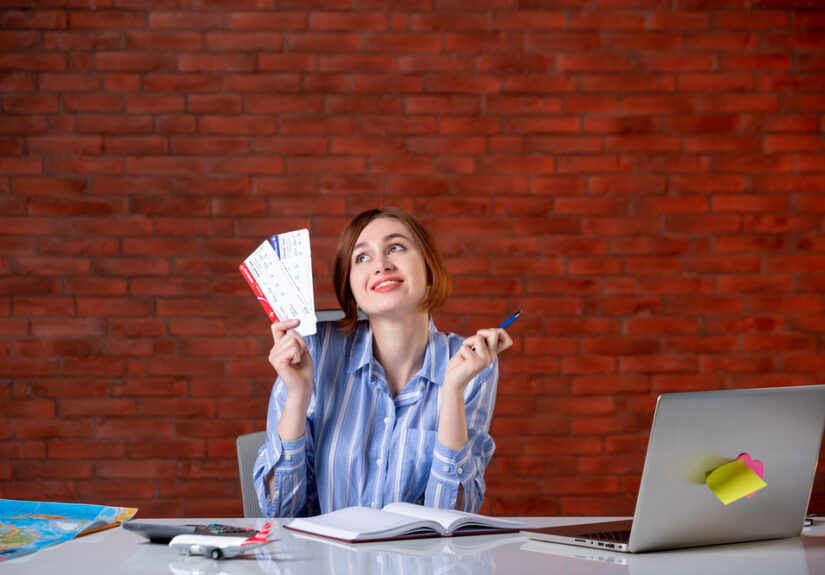 front-view-travel-agent-her-working-place-with-plane-tickets-agency-map-service-global-assistant-world-operator-managers (1)