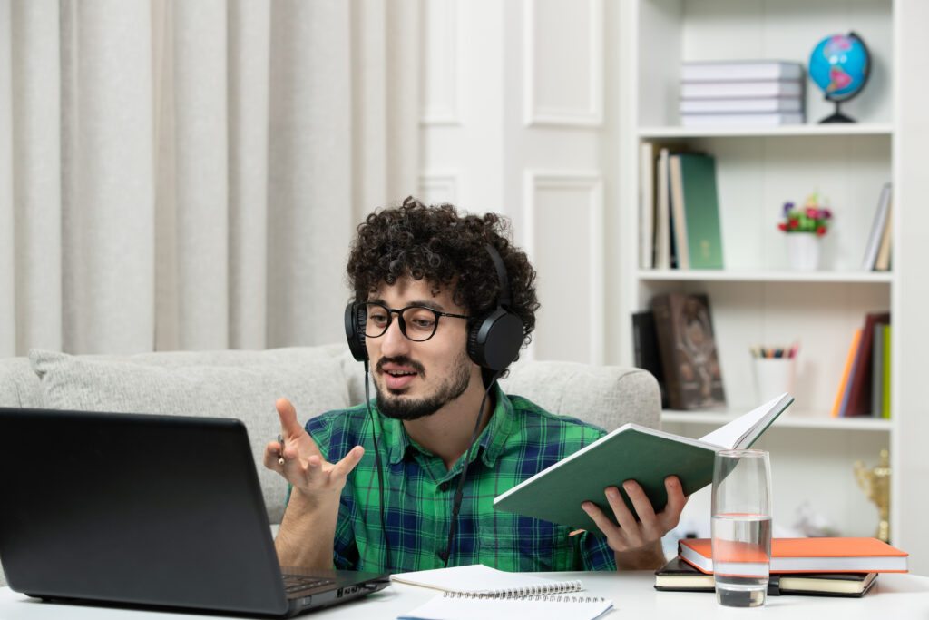 student-online-cute-young-guy-studying-computer-glasses-green-shirt-explaining-class