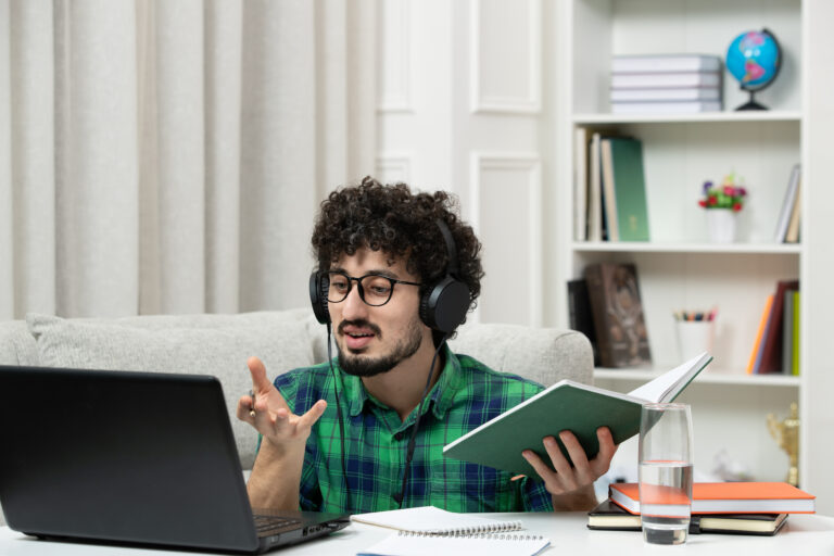student-online-cute-young-guy-studying-computer-glasses-green-shirt-explaining-class